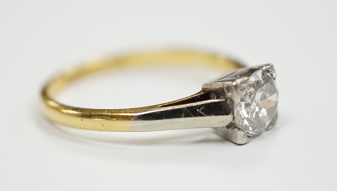 An 18ct, plat. and solitaire diamond ring, size O, gross weight 2.7 grams, the stone measuring 5.7mm in diameter.